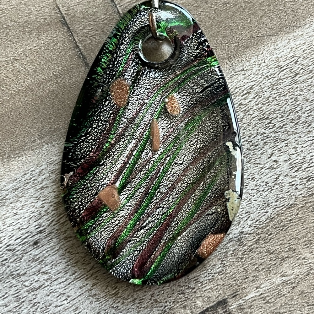 Dichroic glass pendant- black/ green/ white. Approximately 2” long